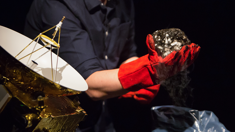 Will Gater carrying out comet making demo on stage during The Story of the Solar System live show